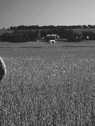 man in soybean field