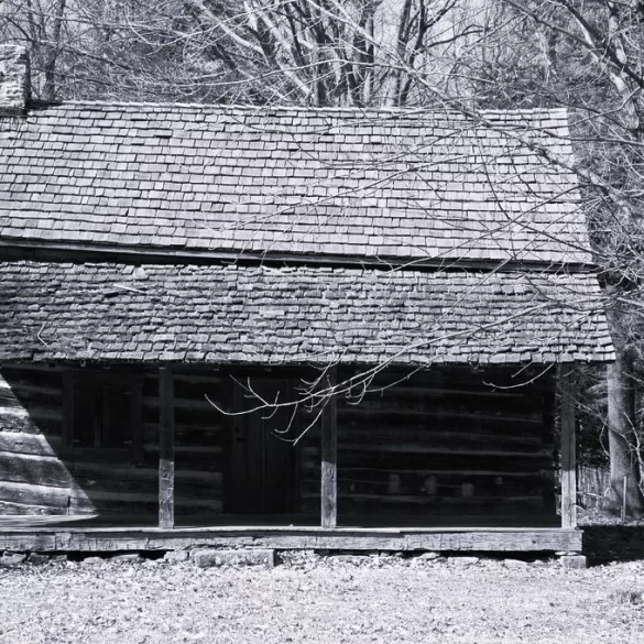 Old man in old cabin by Edgar A. Porter