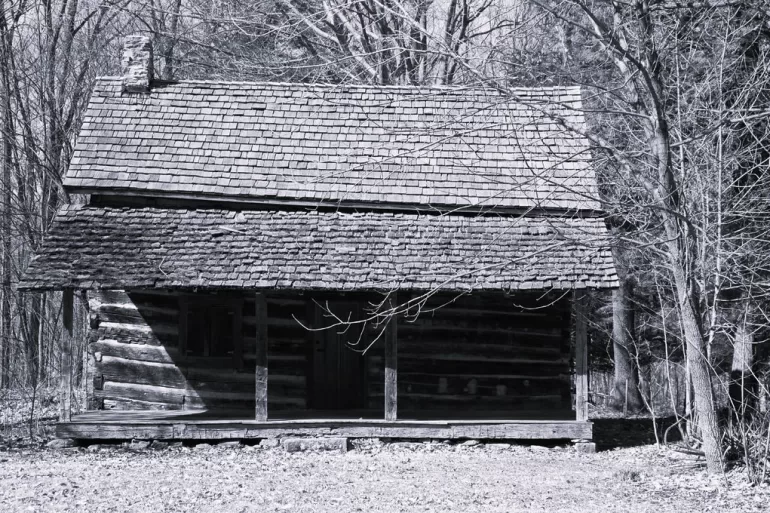 Old man in old cabin by Edgar A. Porter